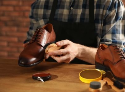 Man shining his leather shoes