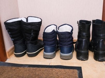 Winter boots on the floor near an entryway